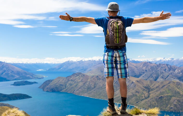 https://www.gowalkabouttravel.com/wp-content/uploads/2021/11/Man-hiking-and-tramping-in-New-Zealand.jpg